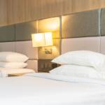 white-comfortable-pillow-blanket-bed-with-light-lamp